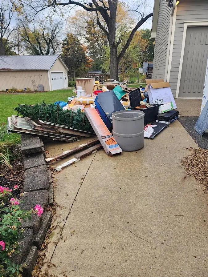 Dumpster being loaded with debris for Residential Dumpster Rental in Nevada